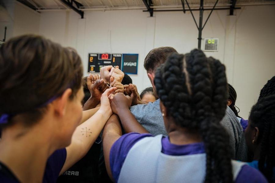 Athletic team in a huddle